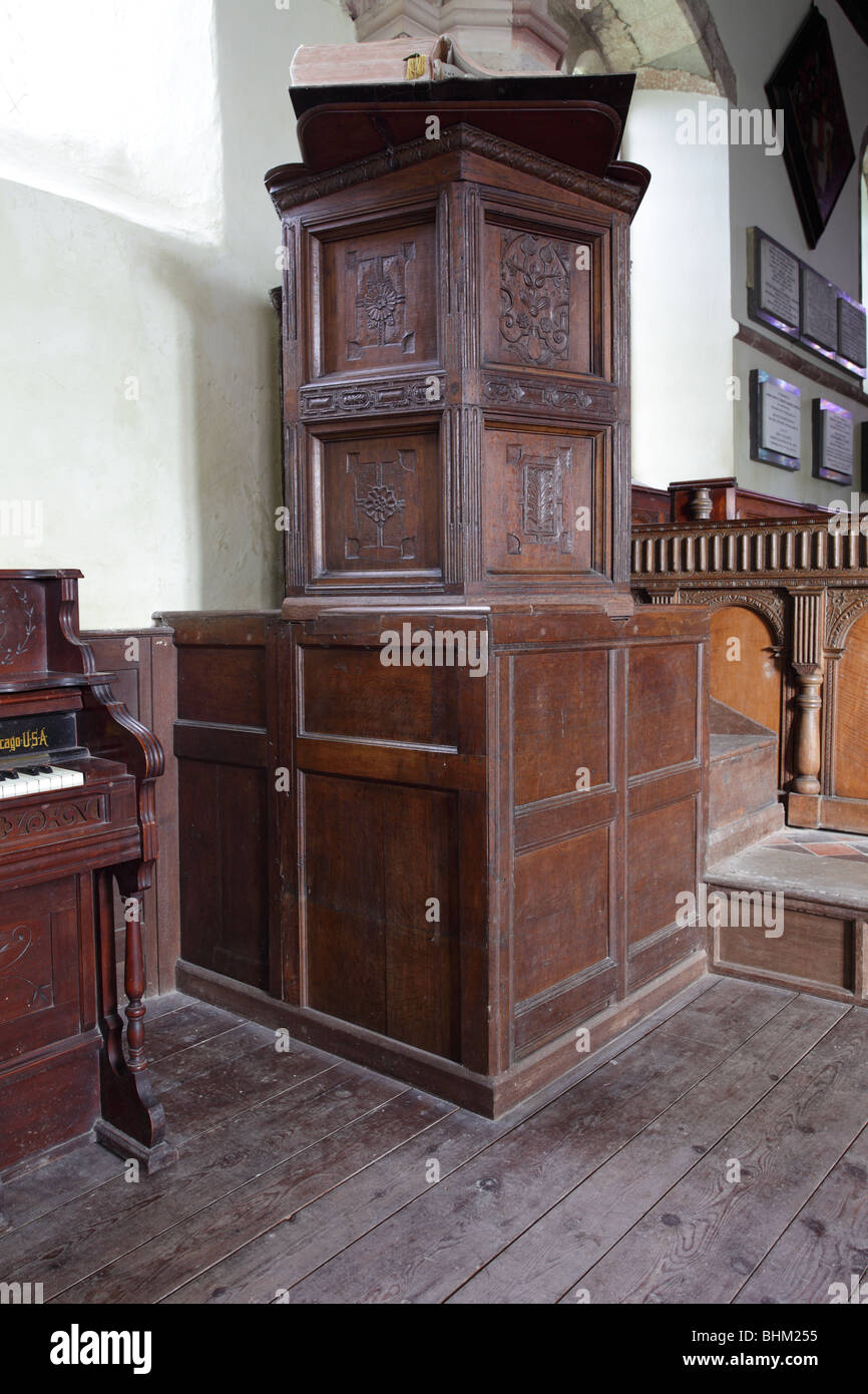 The oak pulpit at St Andrew`s Church in the village of Wroxeter in Shropshire, England. Stock Photo